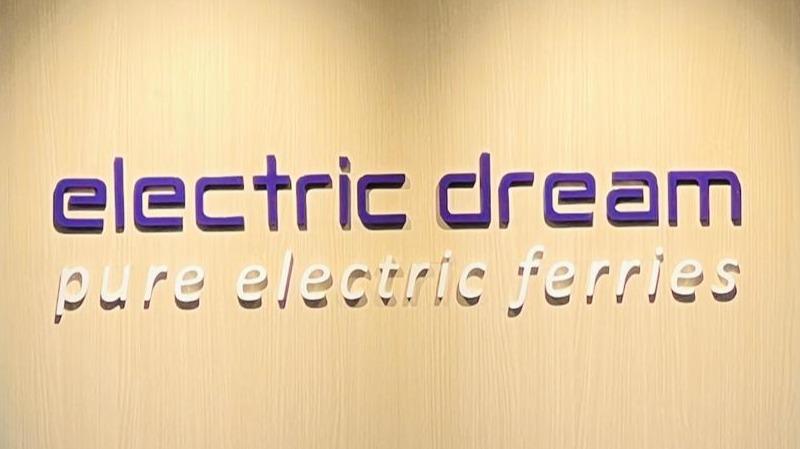 An office sign board with the text "electric dream, pure electric ferries".