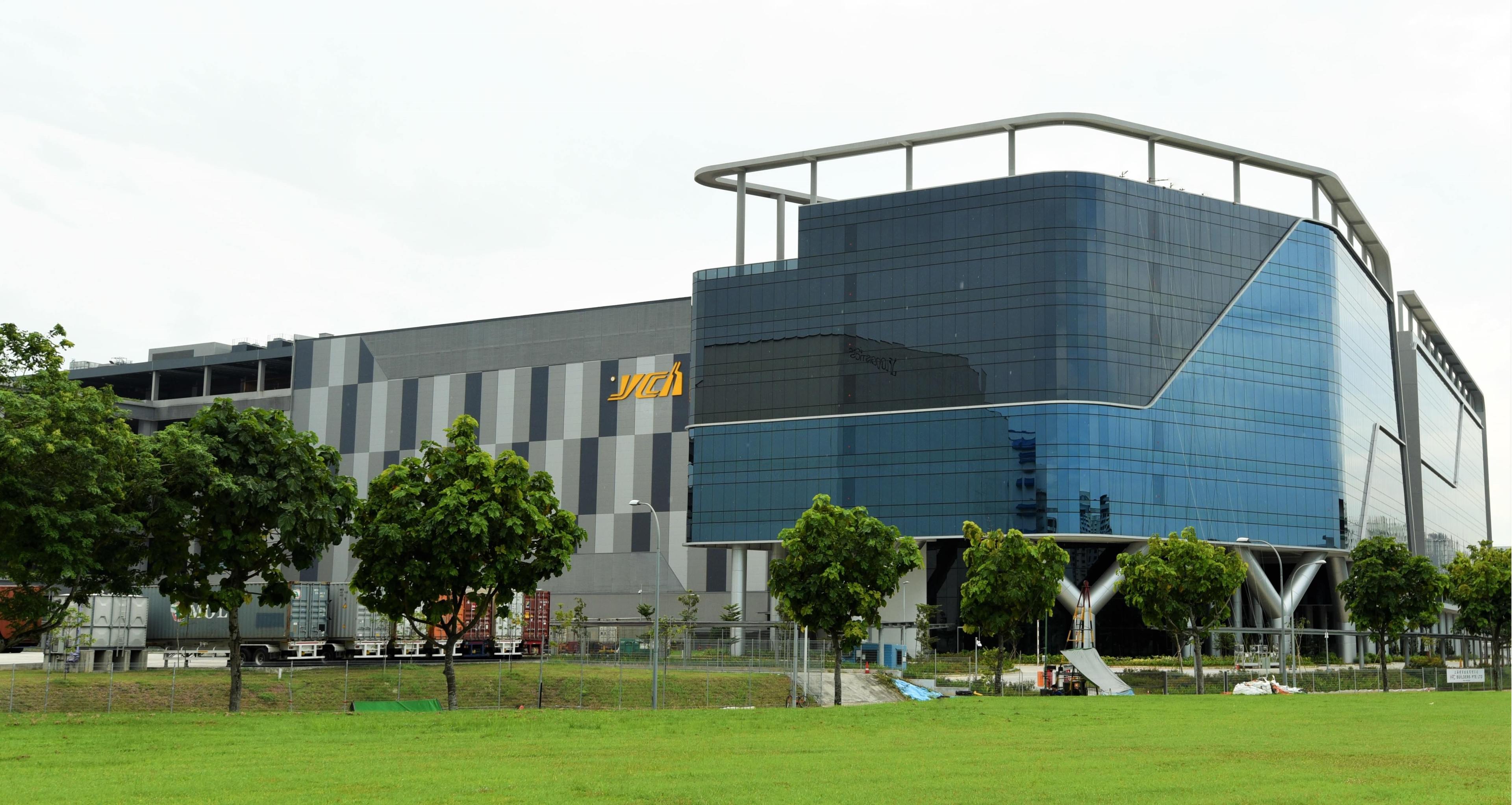 Office Building in the background, green grass in the foreground