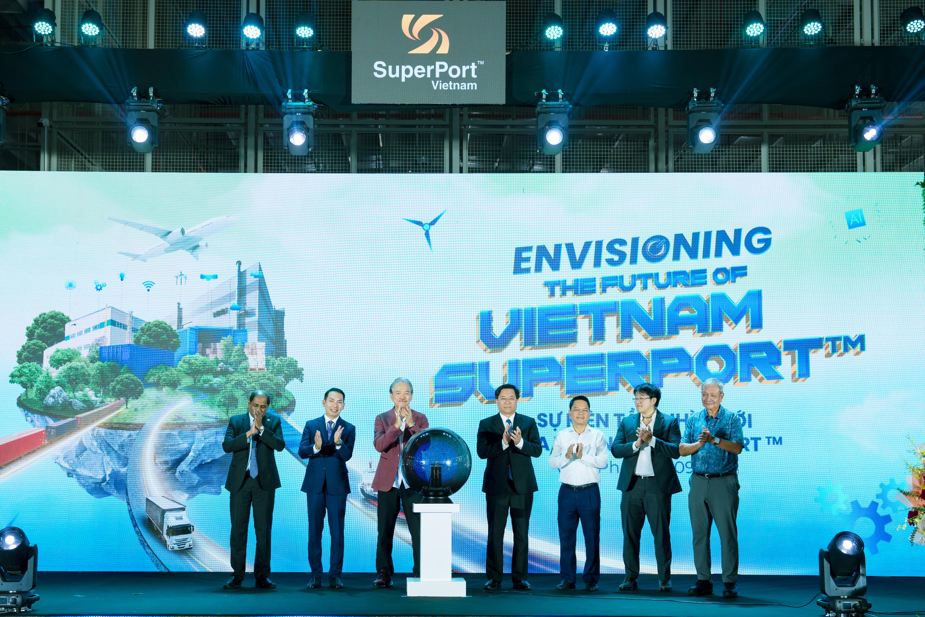 7 men in business suits standing on stage clapping to celebrate event "Envisioning the Future of Vietnam Superport"